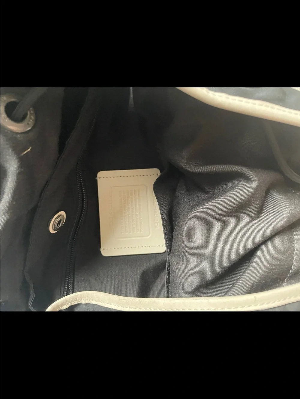 Coach Two-Tone Cream and Black Perforated Leather Backpack